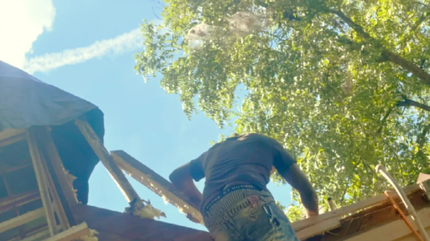 Residential Concerns crew working on a storm-damaged roof in Milledgeville