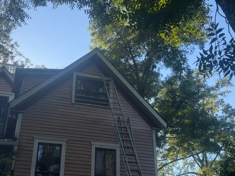 The dormer framing, window opening and siding rebuilt after the tree damage