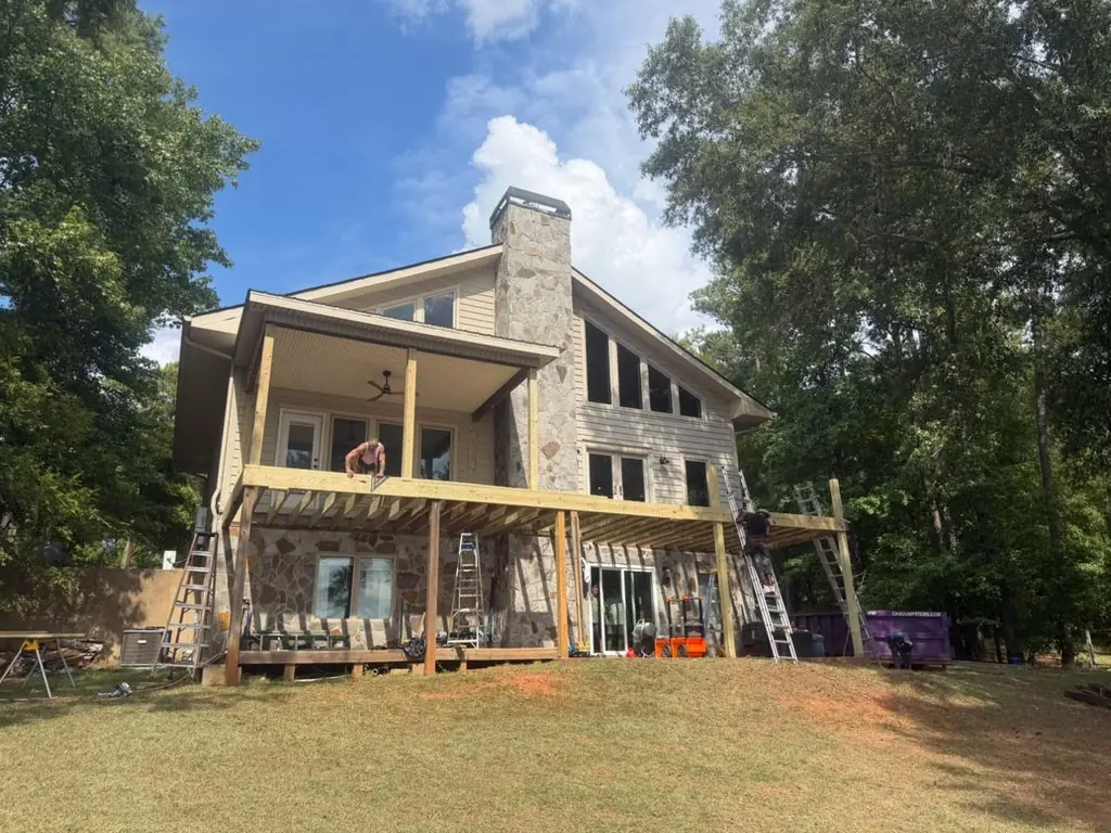 The deck framing going up during the build